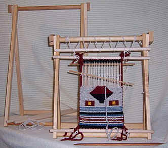 Spriggs Travel A-frame Navajo Looms. Designed by Carl Spriggs for table-top use, they collapse for easy travel with your project still on the loom.Click here for more information.